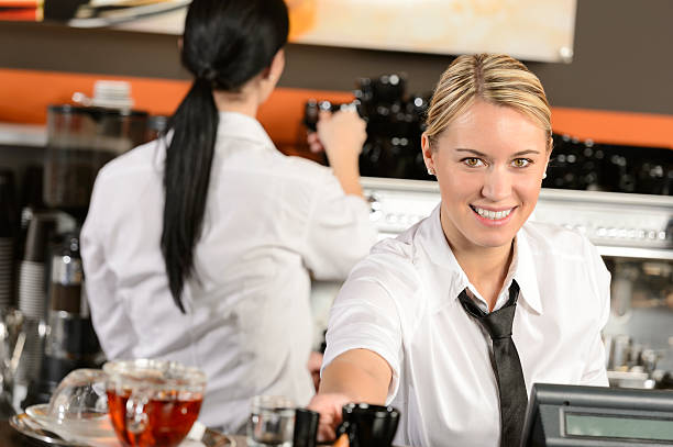istock Young waitress cashier giving coffee in cafe 177831103