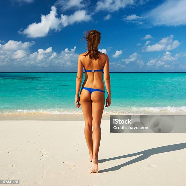 Woman At Beach Stock Photo - Download Image Now - Thong, Beach, Bikini