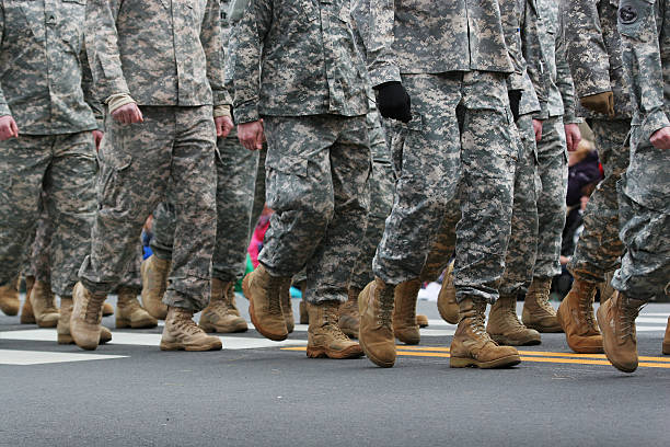 Army Parade Soldiers dressed in army camouflage in an army parade marching stock pictures, royalty-free photos & images