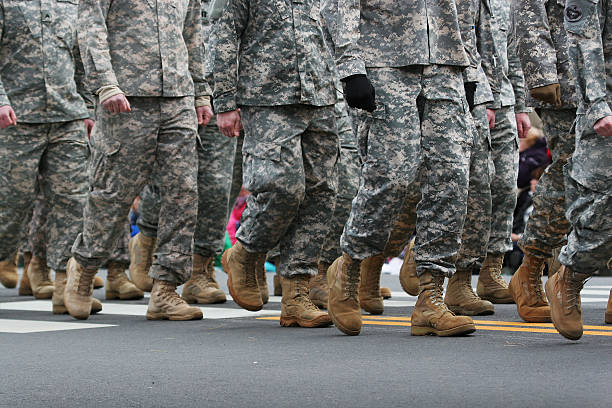 Army Parade Soldiers dressed in army camouflage in an army parade troops marching stock pictures, royalty-free photos & images