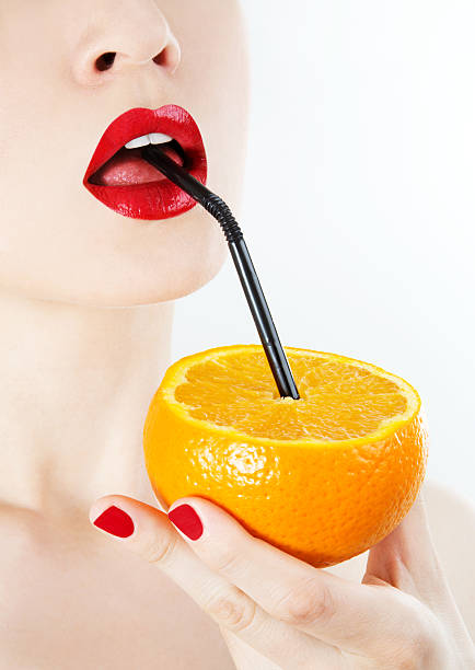 succo d'arancia - human lips orange lipstick human mouth foto e immagini stock