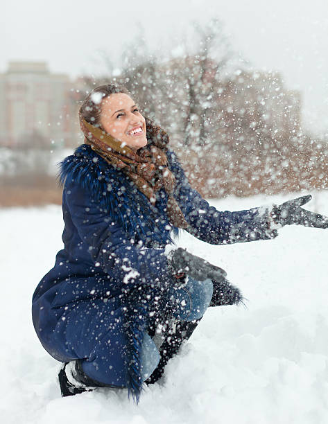 istock young woman throwing snow in air 177831704
