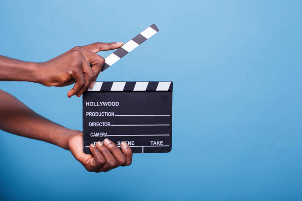 istock Black person clutching a clapperboard 1778317526