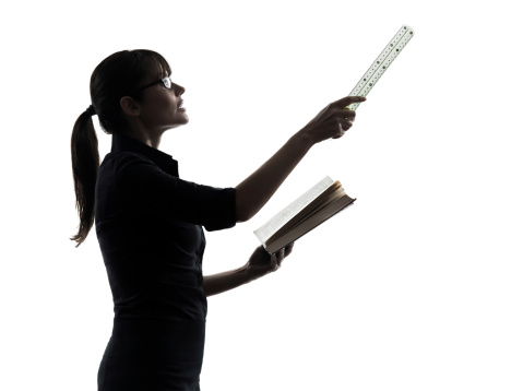 one business woman teacher presentation holding ruler silhouette studio on white background