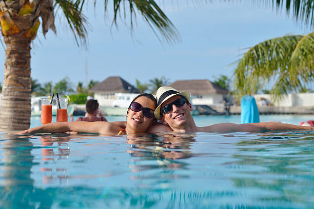 istock happy young couple have fun on beach 177832590