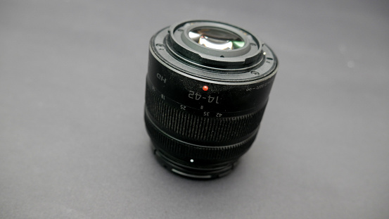 Professional DSLR Camera lense on black background.