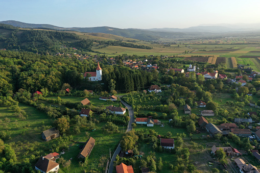 Aerial view of a small village by drone. Bikfalva, Bicfalau, Szeklerland, Romania