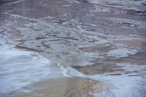 istock Muddy waters in a decantation pond. Toxic residuals from a copper mine decating in a settling basin 1778329228