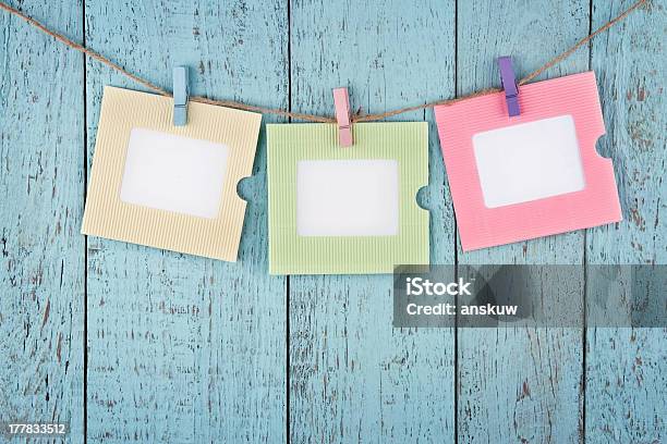 Three Empty Photo Frames Hanging With Clothespins Stock Photo - Download Image Now - Blank, Blue, Clothesline