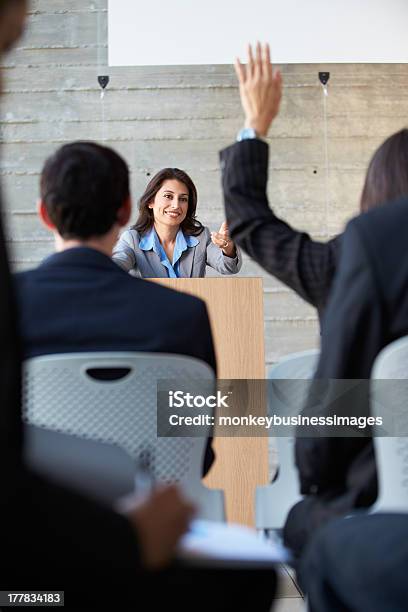 Businesswoman Delivering Presentation At Conference Stock Photo - Download Image Now