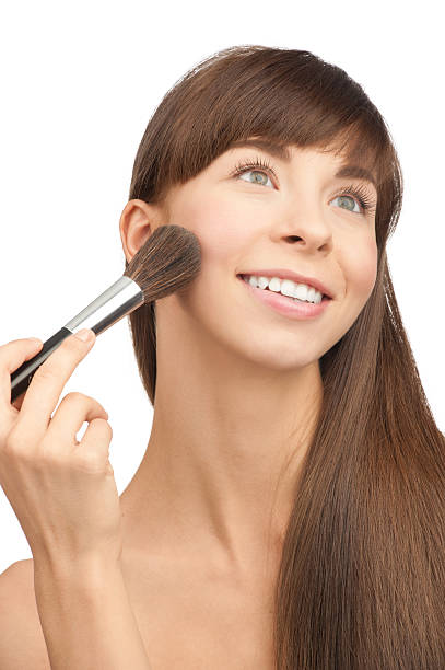 istock Young woman applying makeup 177834762