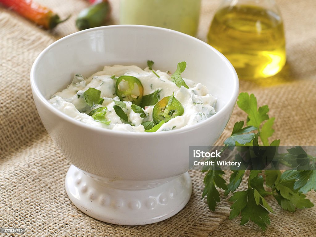 Cheese dip Fresh cheese dip with parsley and chili, selective focus Appetizer Stock Photo