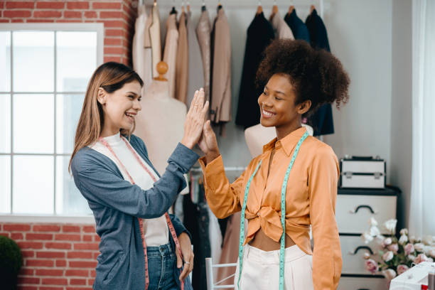 istock two women designer discusses and exchange ideas for clothing design with intention and happiness. 1778353621