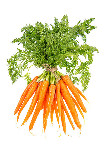 istock fresh carrots with green leaves isolated on white 177835406