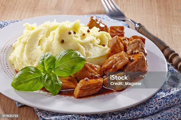 Mashed Potatoes And Meat Stew Stock Photo - Download Image Now - Goulash, Mashed Potatoes, Basil