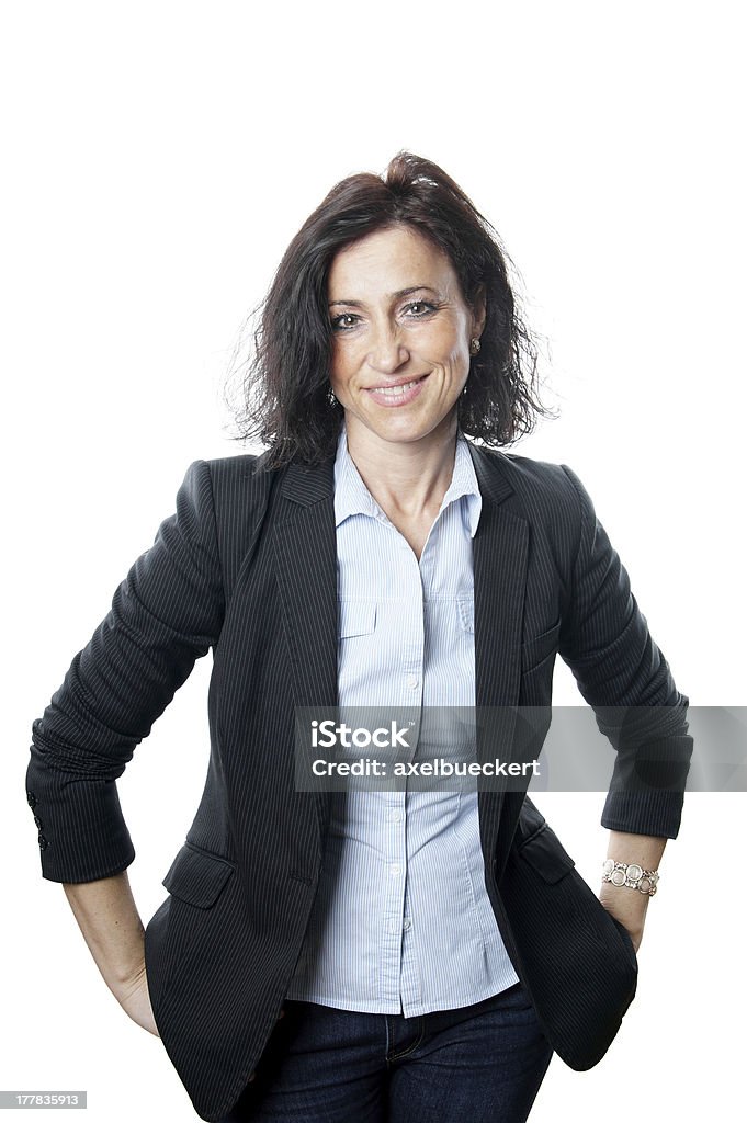 A businesswoman smiling with her hands on her pocket business woman in her forties 40-49 Years Stock Photo
