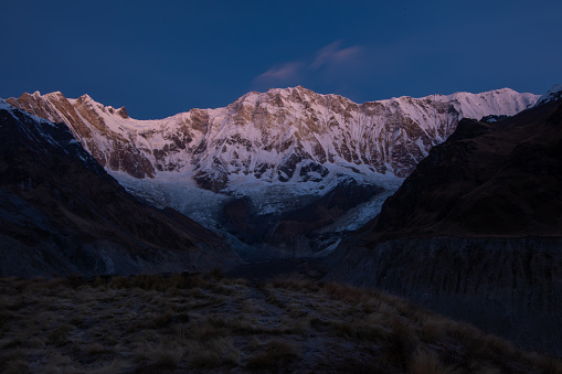 Sarangkot, Pokhara, Nepal - February 10, 2019: the photo was taken in Sarangkot (Pokhara) and shows a glimpse of the Himalaya mountain range, in particular a panoramic view of the Annapurna massif and the Machapuchare mountain (meaning fish tail in Nepalese) standing on the right and also nicknamed the “Matterhorn of Nepal”.