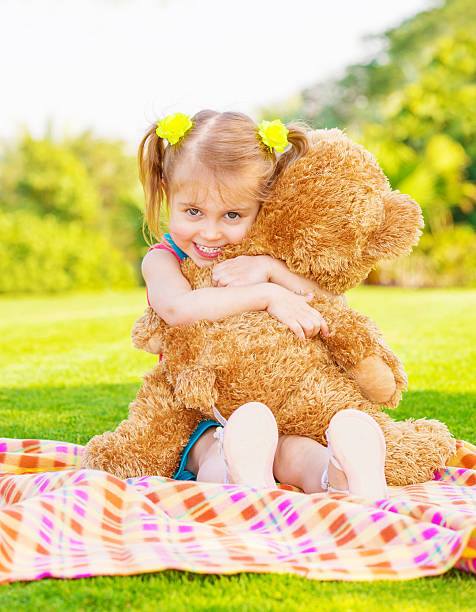 istock Happy girl with teddy bear 177836152