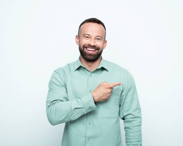 istock Portrait of beared man pointing at copy space 1778367114