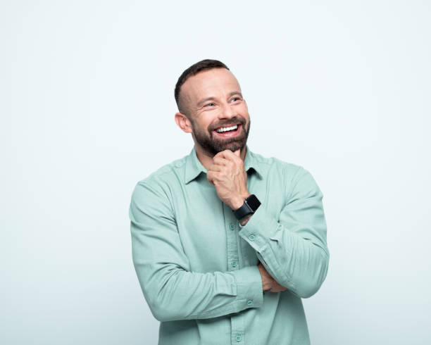 Portrait of happy beared man looking up