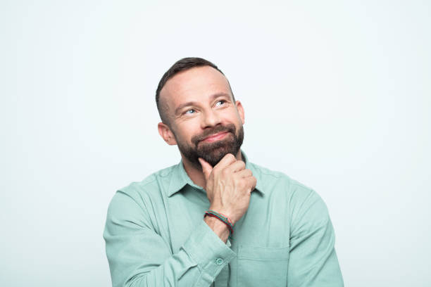 istock Portrait of happy beared man looking up 1778369828