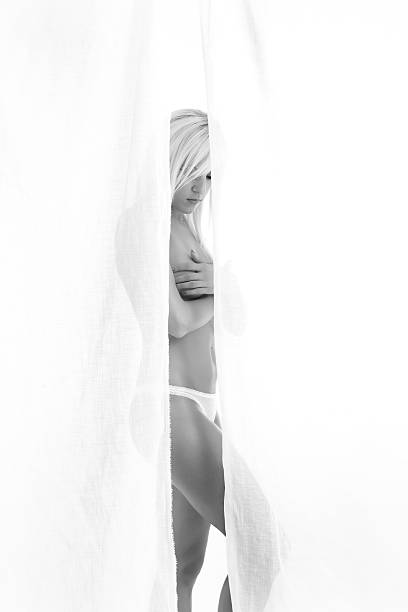 istock naked woman behind white curtains 177837007