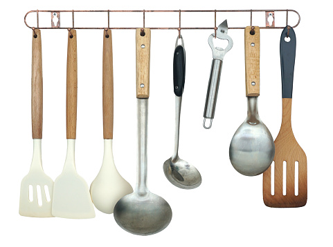 Cooking equipment made of wood, metal and plastic Hanging on a hanger isolated on white background