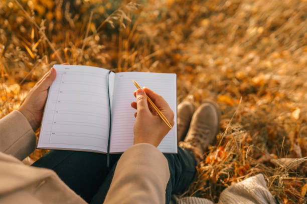 istock Girl with paper planner outdoors, autumn concept 1778376123