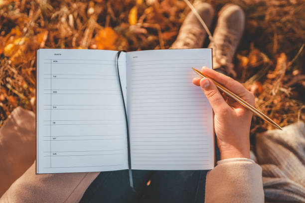 istock Girl with paper planner outdoors, autumn concept 1778376125