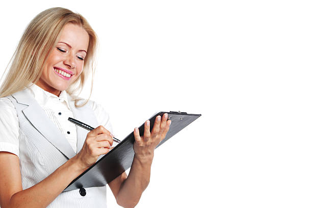 istock business woman writing in notebook 177838071