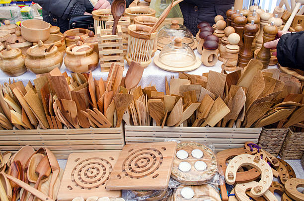 handmade diy wooden kitchen utensil tools sold in bazaar store fair.