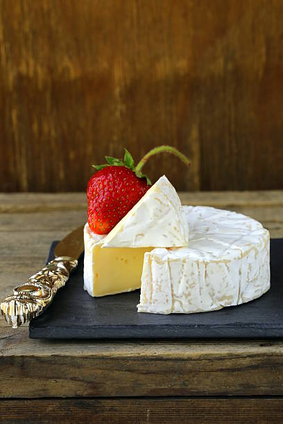 istock round piece of soft cheese (brie, camembert) 177838440