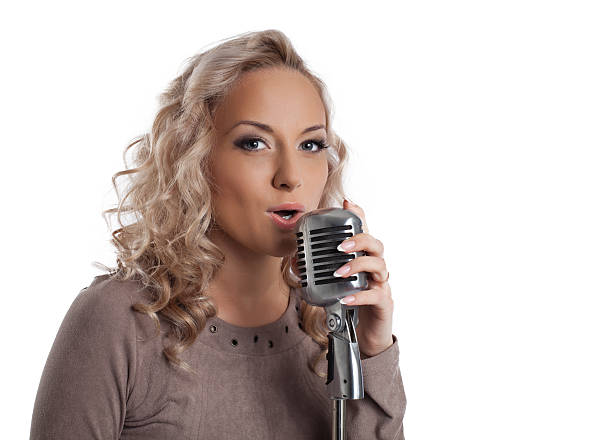 istock Blonde woman with vintage microphone 177838566