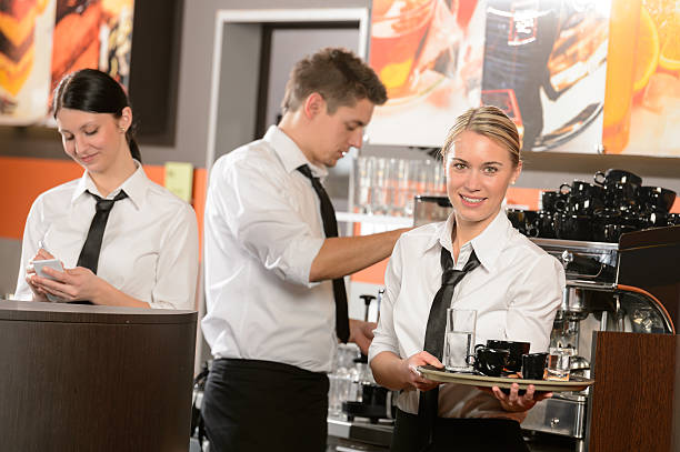 istock Confident waitresses and waiter working in bar 177839368