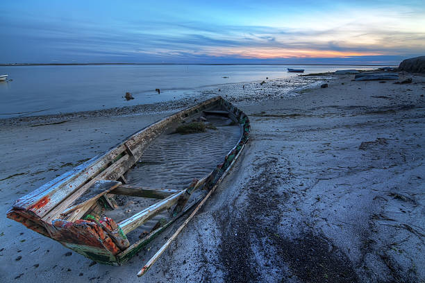 istock Old abandoned broken boat at sea against seascape. 177839553