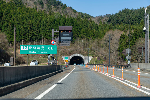 Hida, Gifu, Japan-April 20, 2023; Driver’s perspective view over E41 Tokai Hokuriku Expressway towards the Odori Tunnel