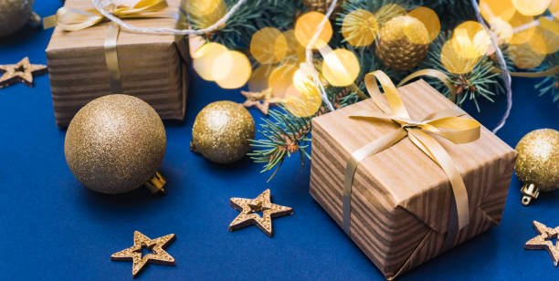 istock Christmas composition with fir branches and christmas decorations, garland, gift box on a blue background. Winter merry christmas holiday greeting card 1778406115