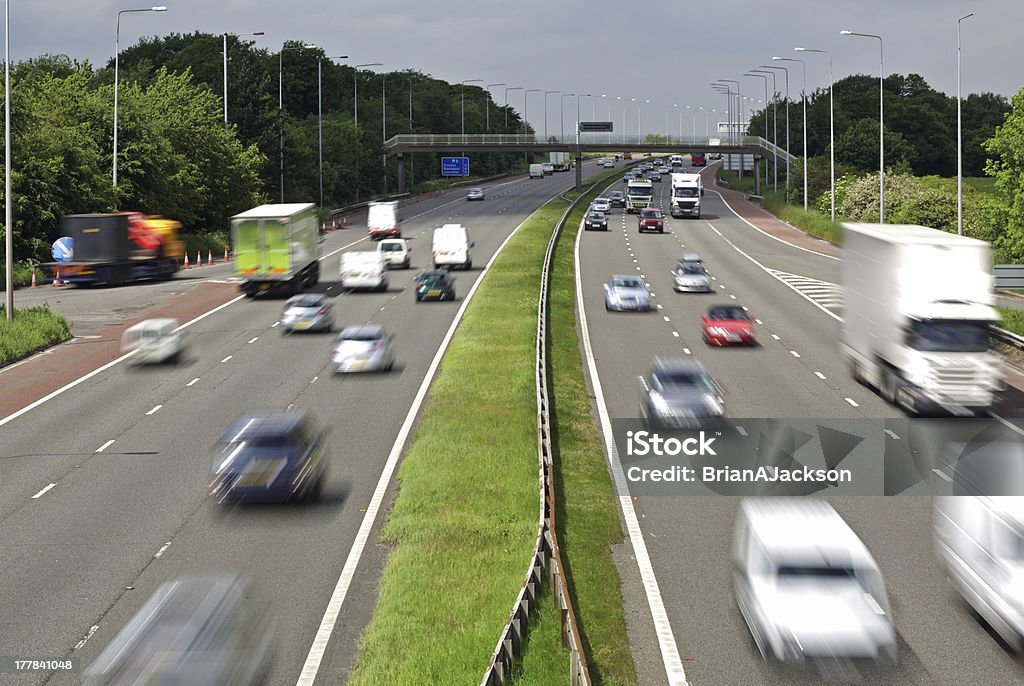 Motorway traffic Heavy traffic moving at speed on the M6 motorway in England UK Stock Photo