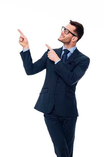 istock Smiling young businessman pointing at copy space 177841128
