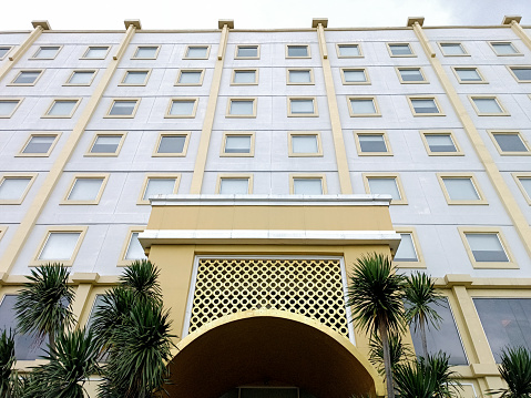 an Entrance of Khas Hotel Surabaya. Retro Style building. Surabaya, East Java, Indonesia. October 02, 2022