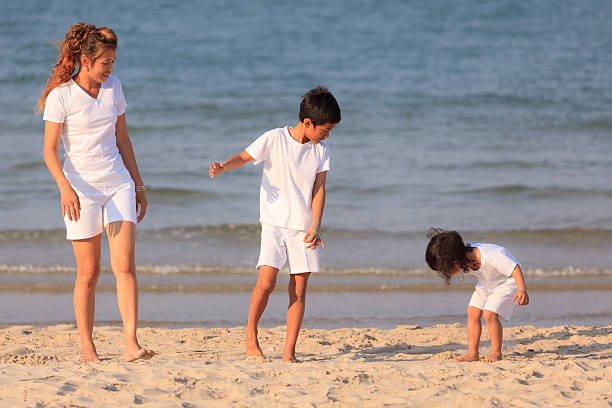 istock Asian family on beach 177841996