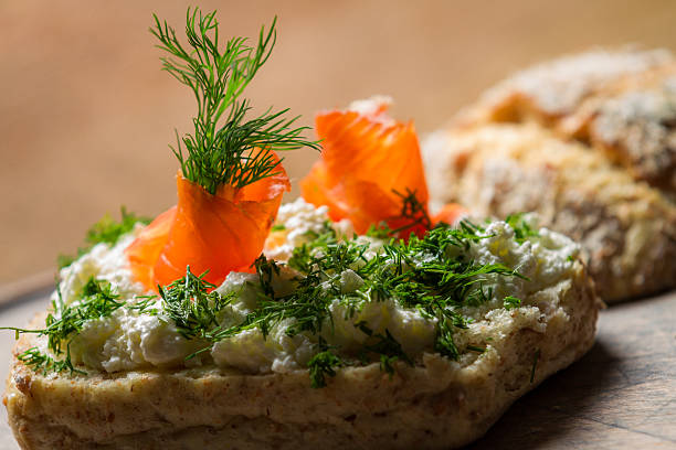 Sandwich made of cottage cheese, salmon and dill