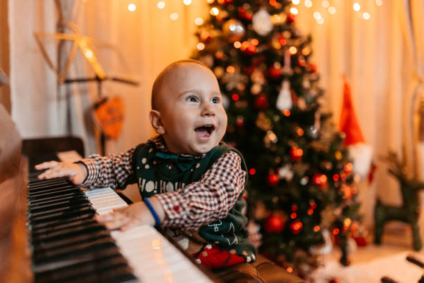 Baby Boy Playing The Piano For Christmas
