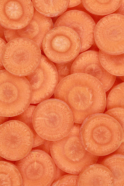 istock Slices of carrots forming a background 177842437