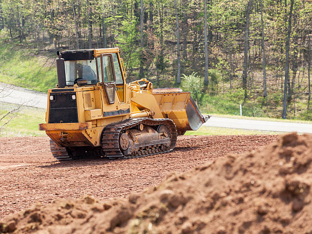 grande escavadora mecânica digger limpar terra - construction machinery machine industrial equipment grader - fotografias e filmes do acervo