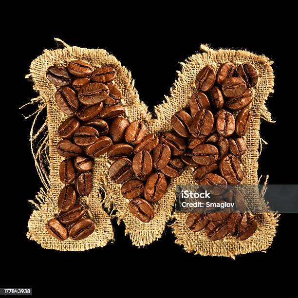 Foto de Alfabeto De Grãos De Café Com Textura De Tecido Preto Isolado e mais fotos de stock de Bebida