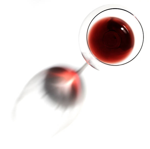 glass of red wine from above in white background with shadow