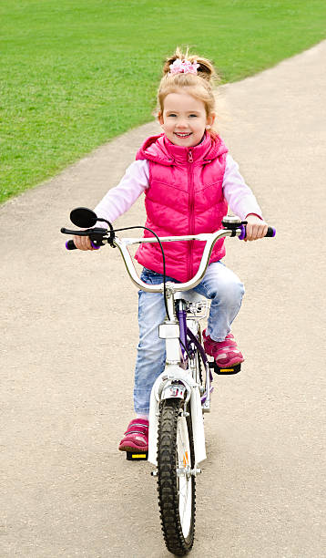 istock Little girl with her bicycle 177844350