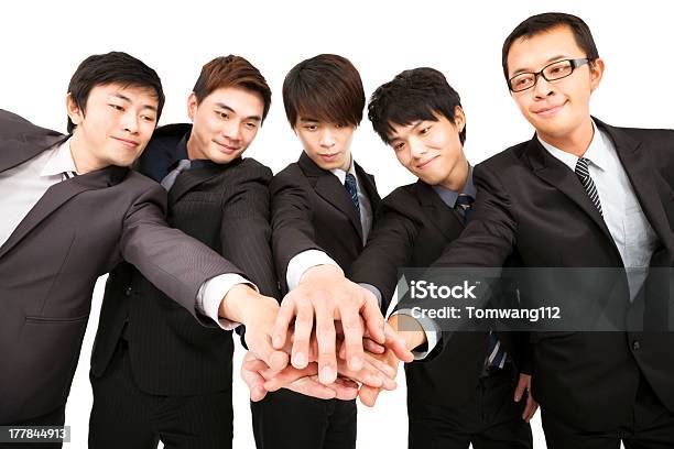 Foto de Businessteam Com Mãos Juntas e mais fotos de stock de Acordo - Acordo, Adulto, Amizade