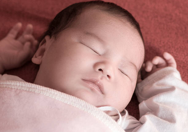 istock Newborn baby sleeping on the bed 177845009